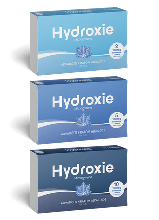 Three boxes of Hydroxie Mitragynine on a green background